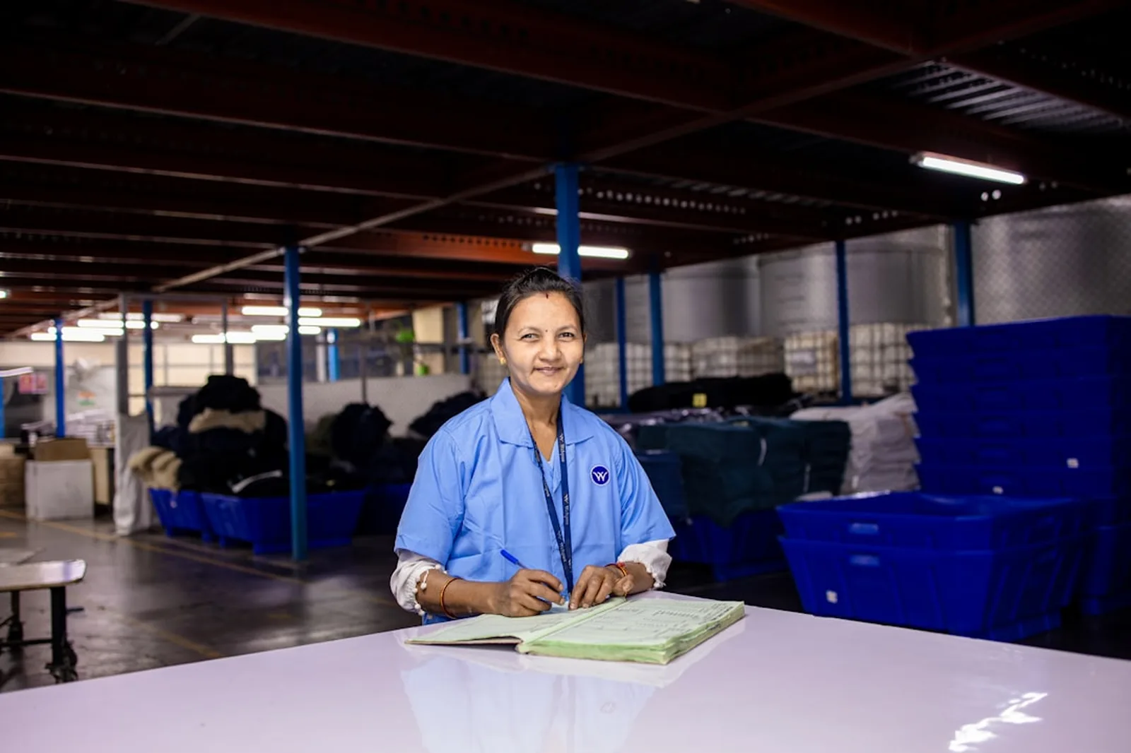 Patricia Wells on the floor of the Wellspring operations facility
