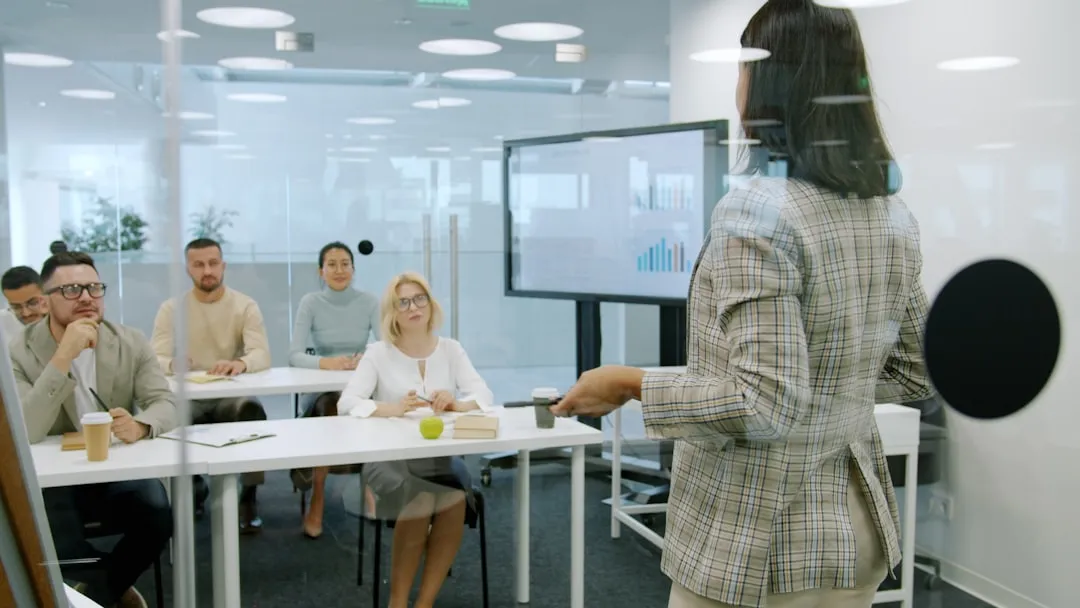 Woman founder presenting confidently to investors in a modern boardroom