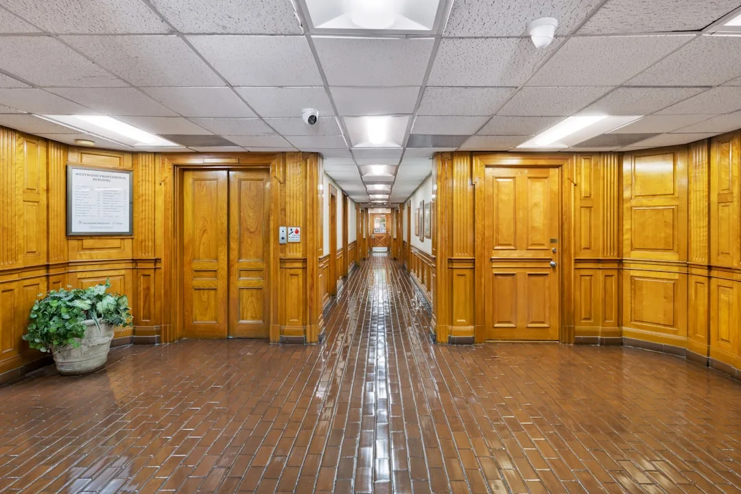 Empty government hallway with closed doors symbolizing institutional absence
