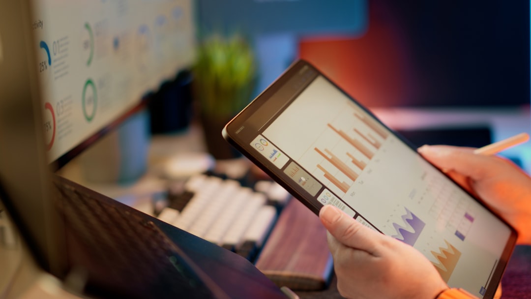 Woman reviewing clean business analytics on her tablet