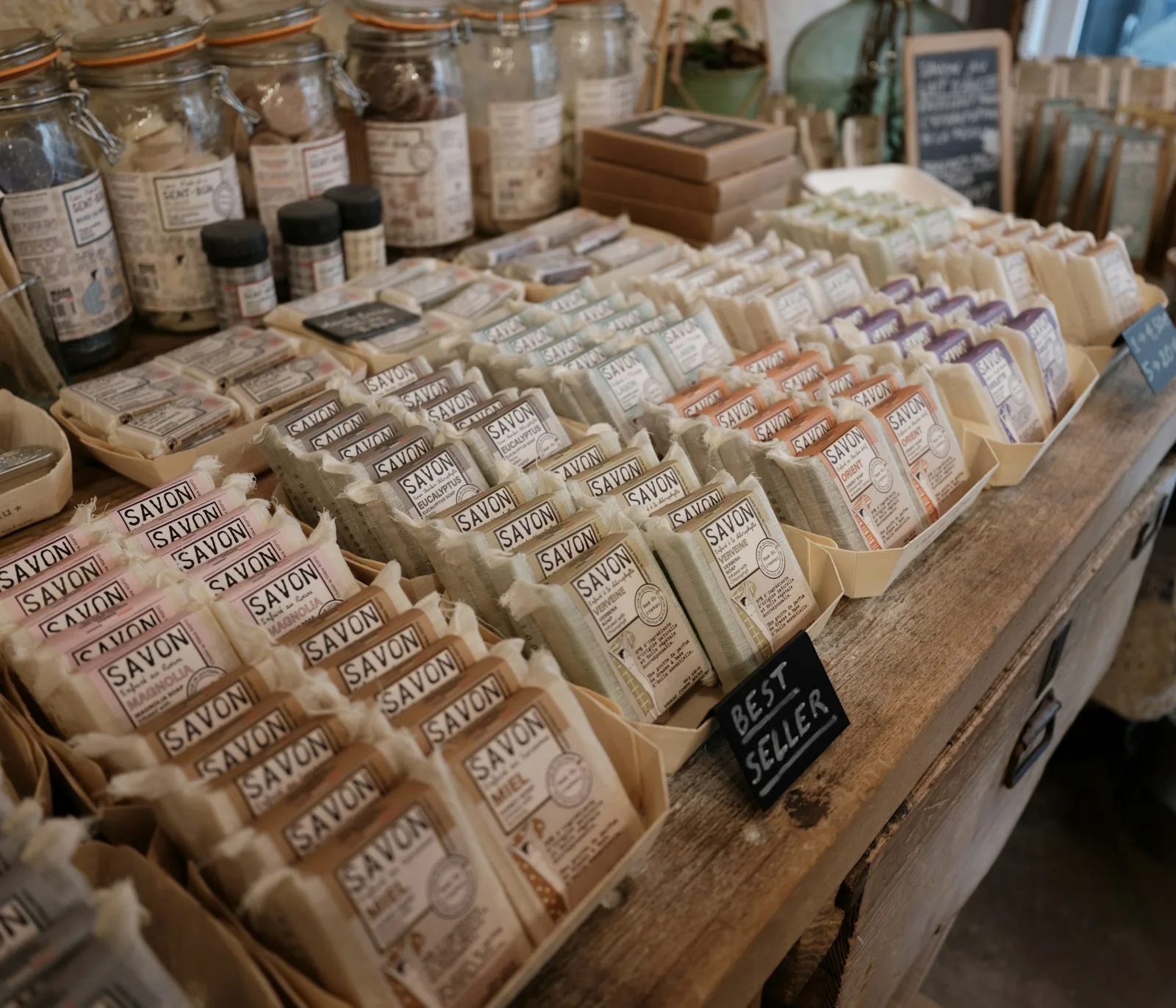 Handcrafted skincare products lined up on a boutique retail shelf