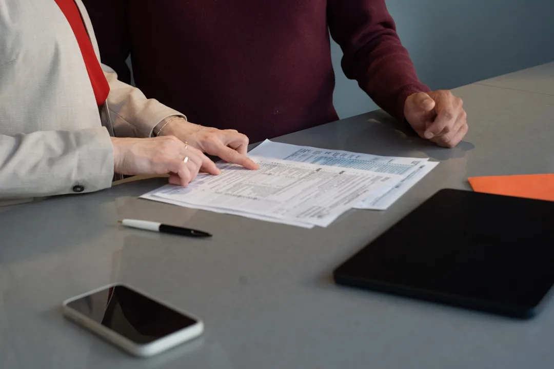 Woman reviewing legal documents at a professional desk