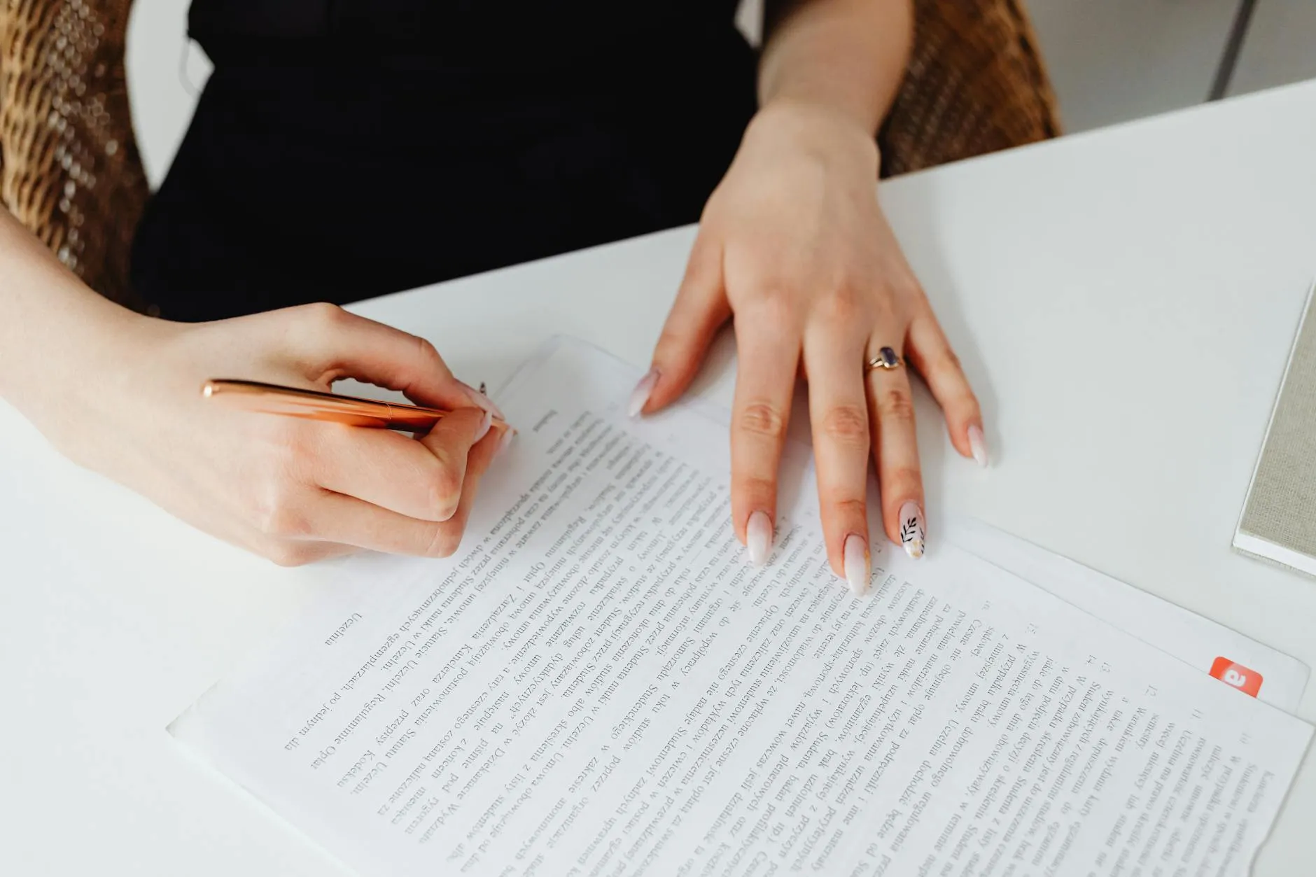 Woman entrepreneur signing a legal business document