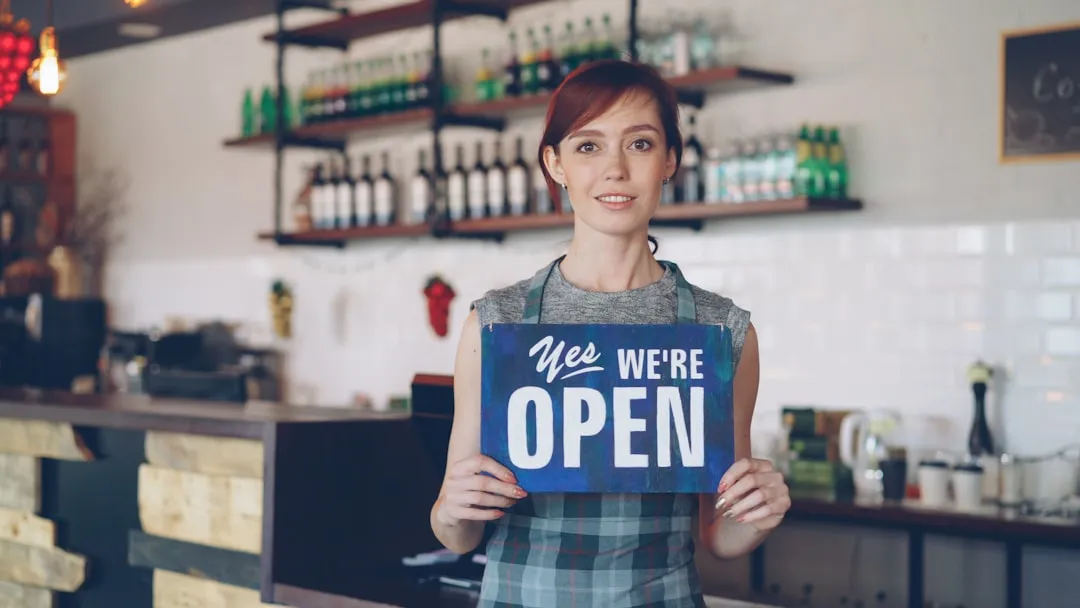 Woman entrepreneur inspecting a small business storefront as a new owner