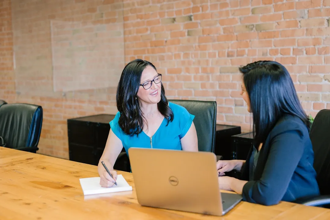 Professional woman in advisory meeting reviewing business financials