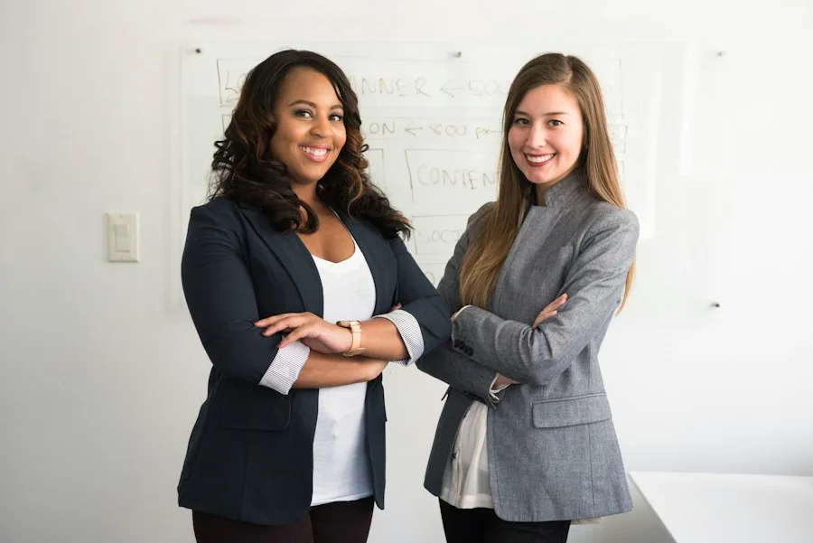 Business meeting between woman entrepreneur and banker discussing loan terms