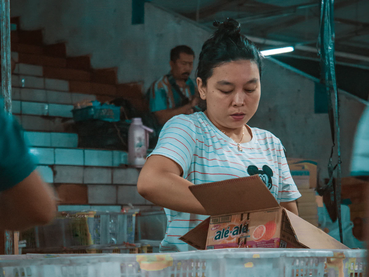 Self-employed woman working on product packaging
