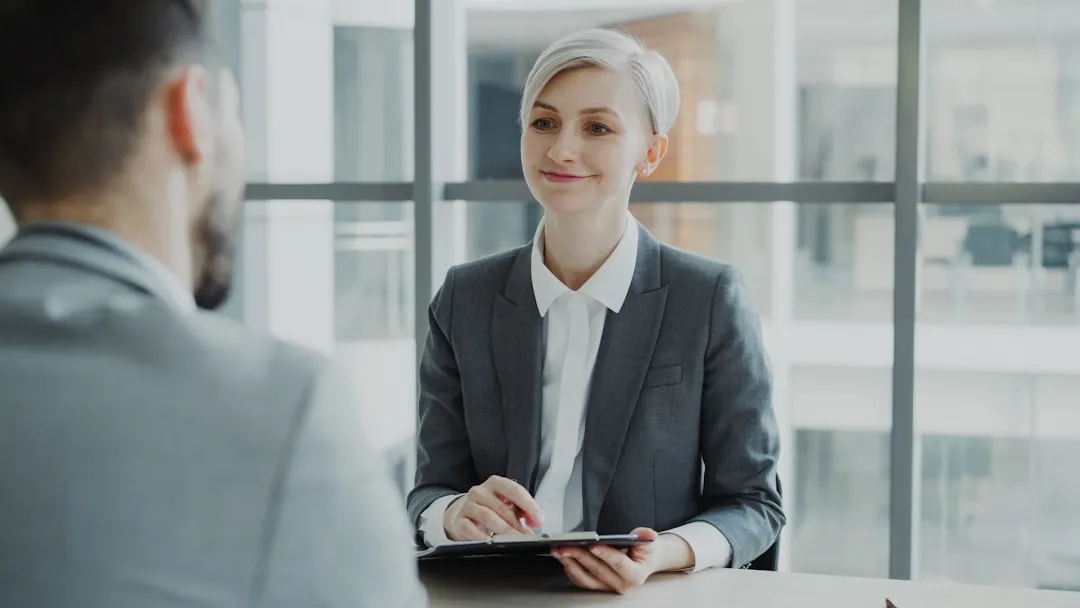 Mature woman in a professional business meeting discussing financing with a lender