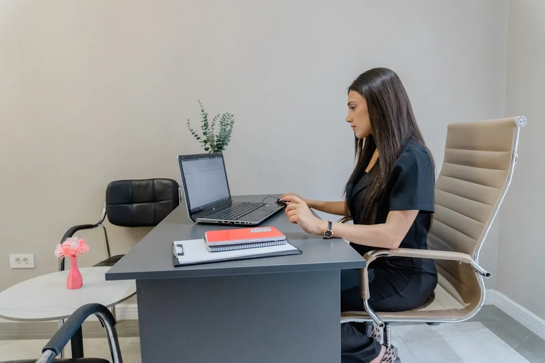 Woman professional searching for federal contracting opportunities on her laptop